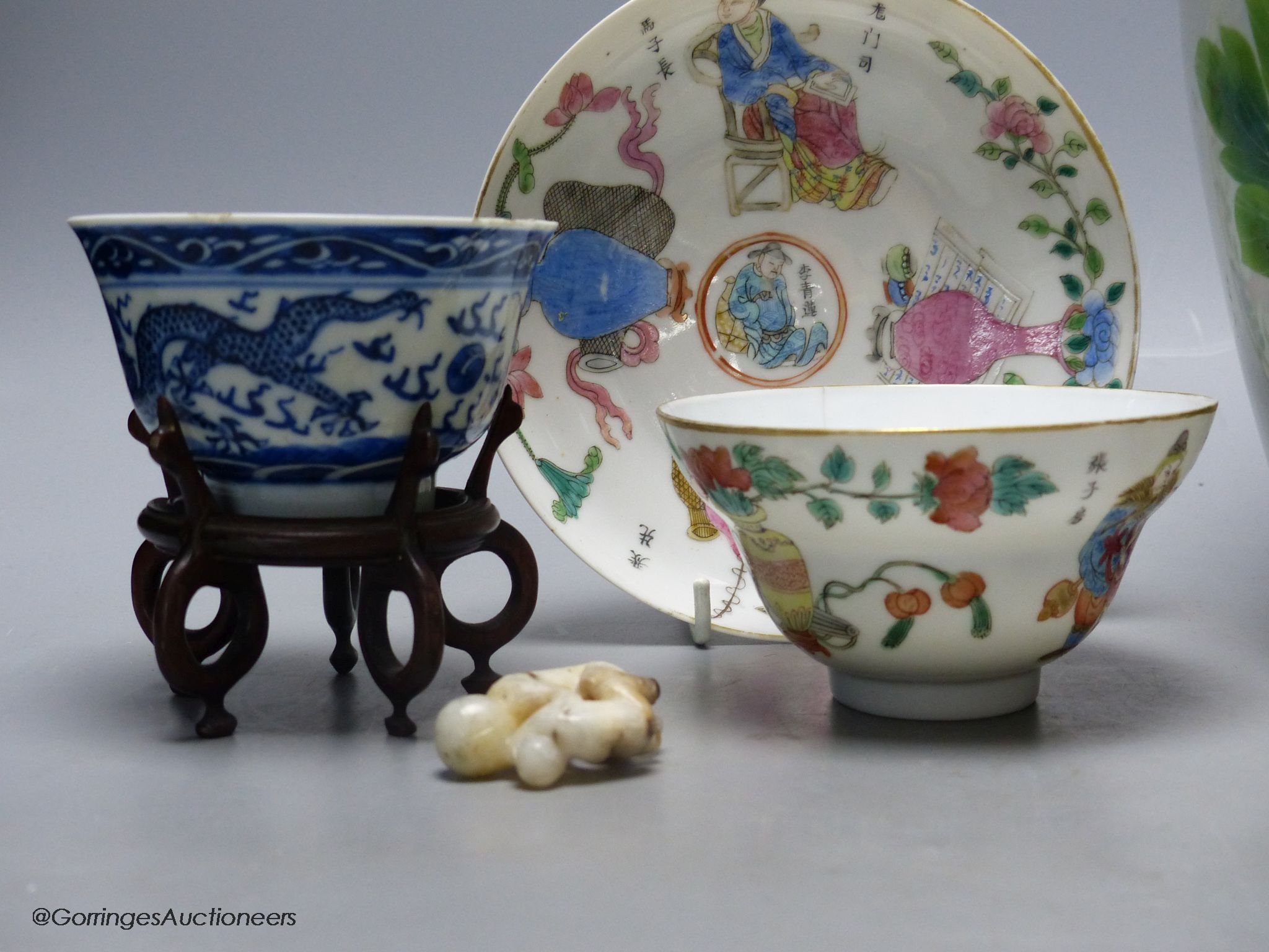 A 19th century famille rose bowl and stand, a blue and white cup, a famille rose jar and a stone carving of two monkeys